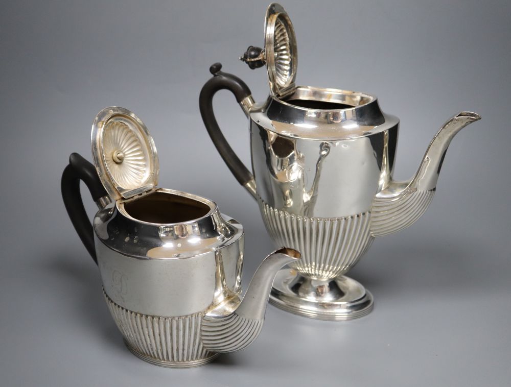 An Edwardian four piece demi-fluted oval silver tea and coffee set, Mappin & Webb, Sheffield, 1902, gross 38oz.